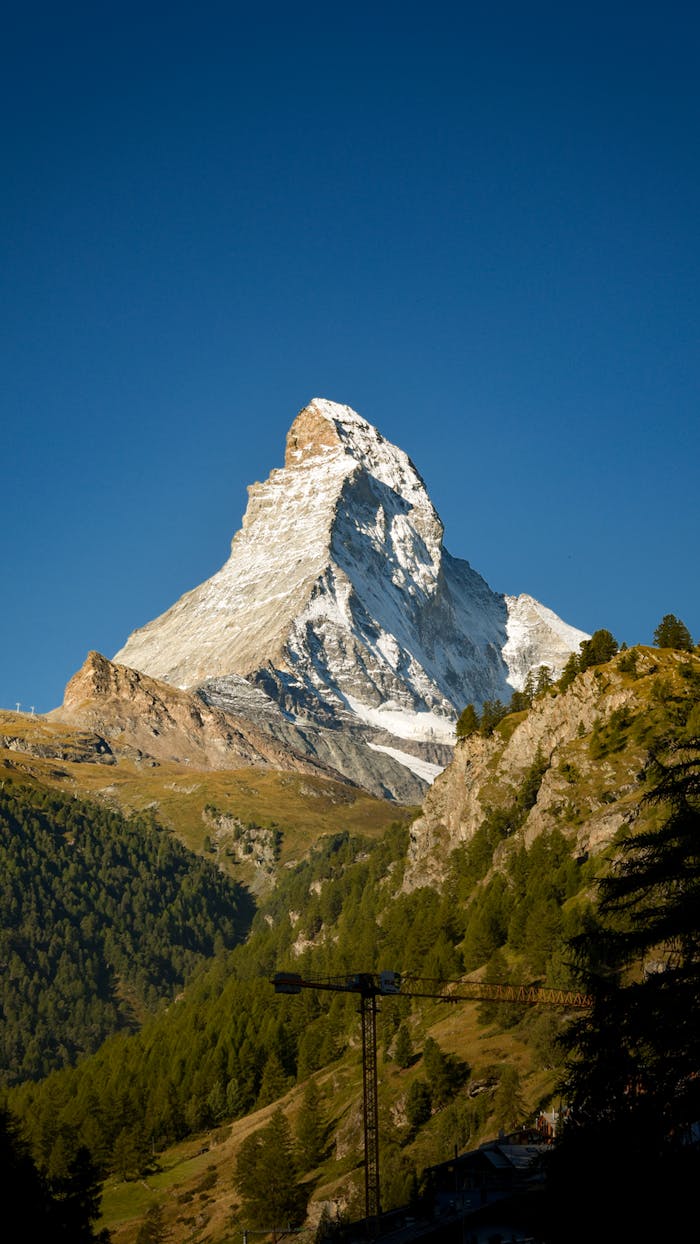 Stunning capture of the Matterhorn in the Swiss Alps with clear blue skies.